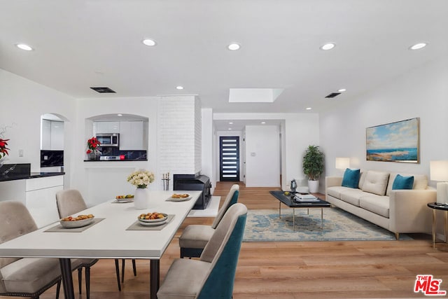 dining room with wood-type flooring