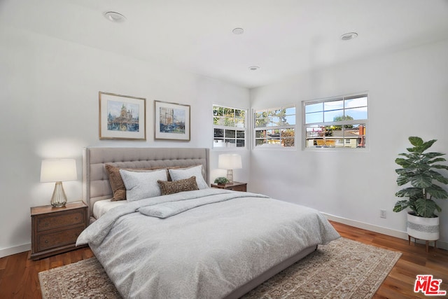 bedroom featuring dark hardwood / wood-style floors