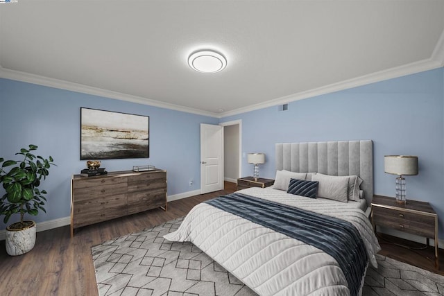 bedroom with wood-type flooring and crown molding