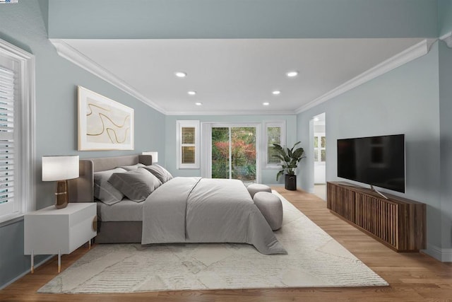 bedroom featuring access to outside, crown molding, and light wood-type flooring