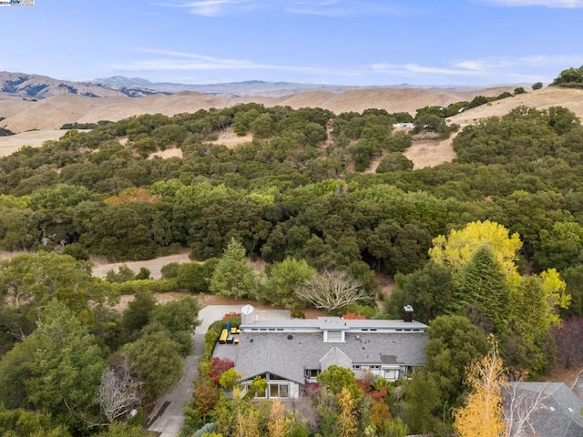 birds eye view of property featuring a mountain view