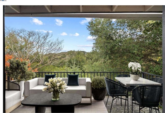 exterior space with an outdoor living space and a balcony