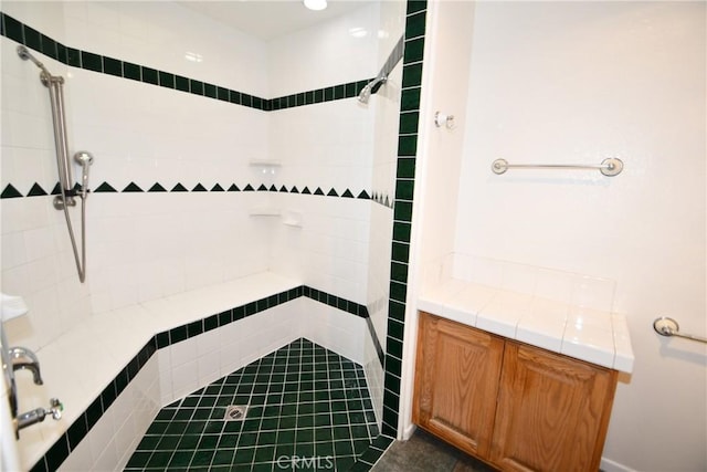 bathroom with tiled shower