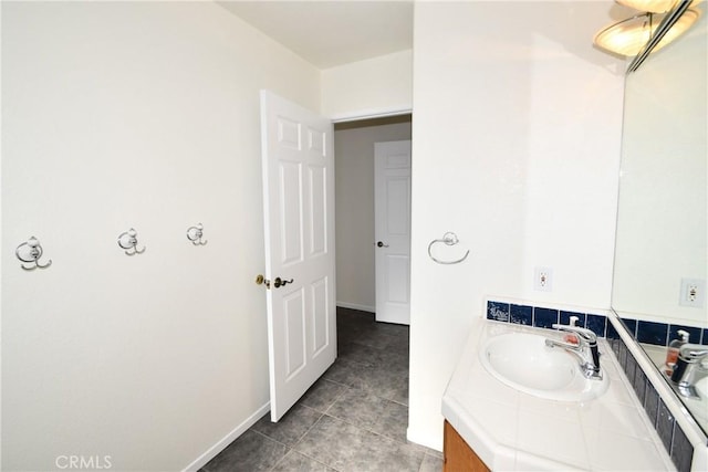 bathroom featuring tile patterned flooring and vanity