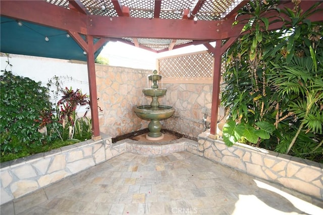 view of patio featuring a pergola