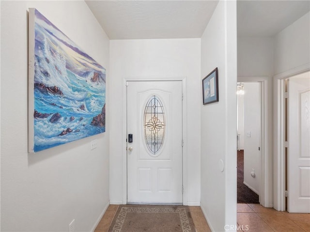 entrance foyer featuring light tile patterned floors