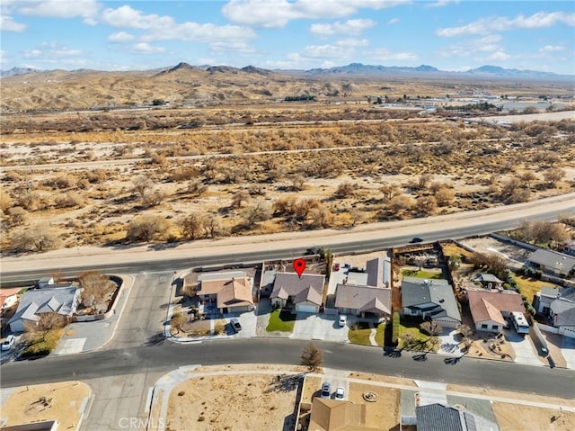 drone / aerial view featuring a mountain view