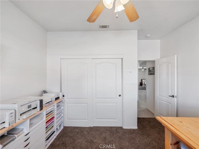 interior space featuring ceiling fan