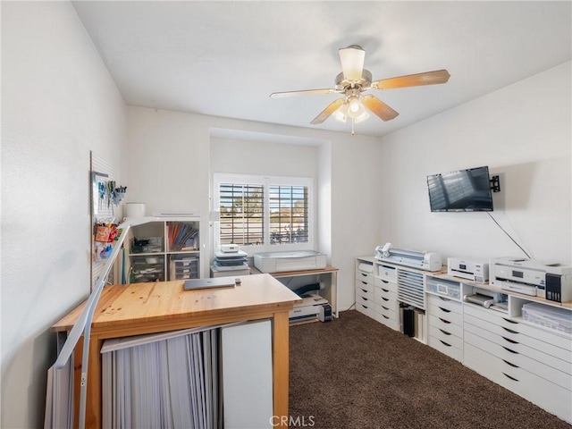 carpeted home office with ceiling fan