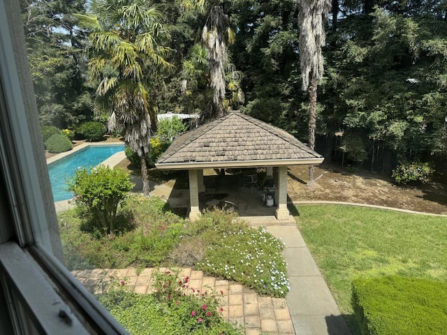 view of yard with a gazebo and a fenced in pool