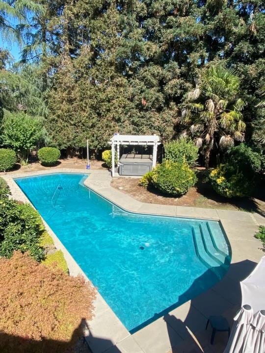 view of pool with a pergola