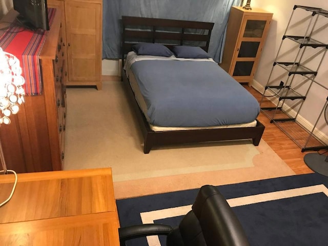 bedroom featuring hardwood / wood-style floors