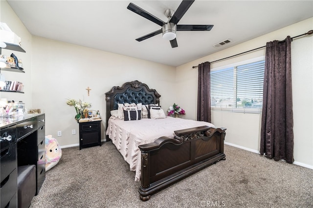 bedroom with ceiling fan and dark colored carpet