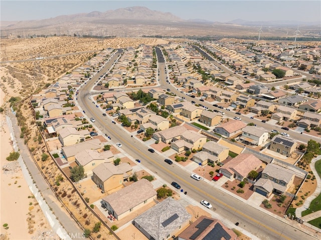 birds eye view of property with a mountain view