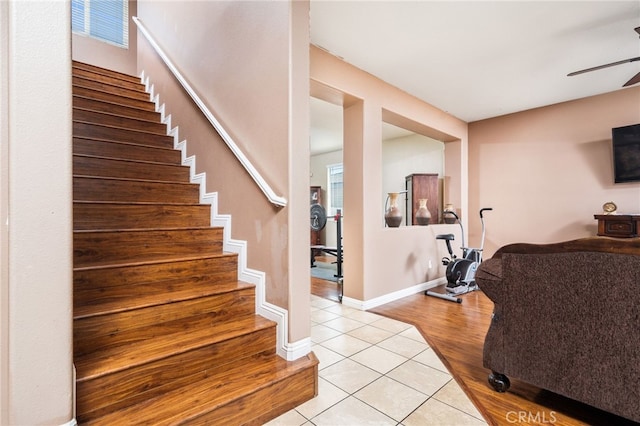 stairs featuring hardwood / wood-style floors