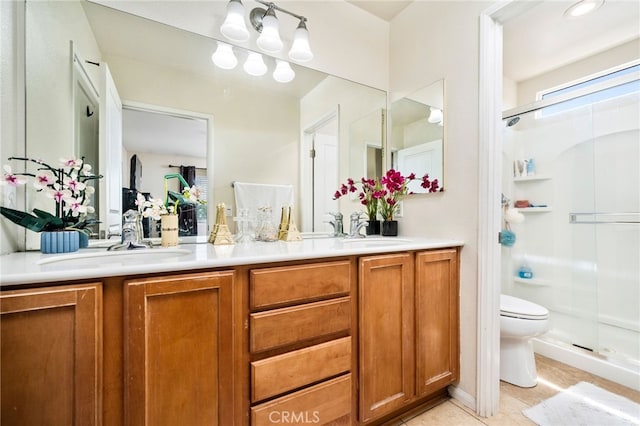 bathroom with tile patterned flooring, toilet, vanity, and walk in shower