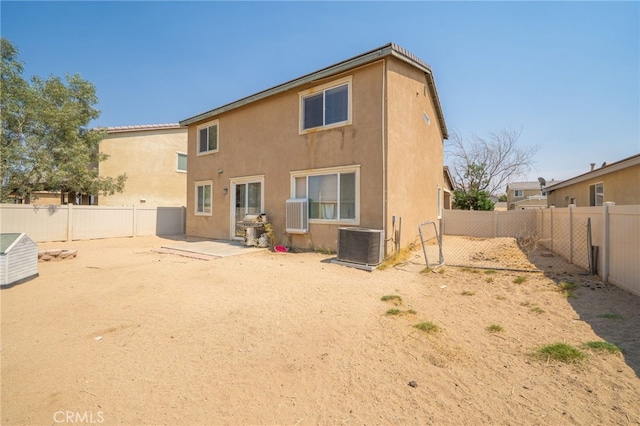 back of property featuring cooling unit