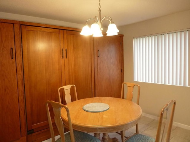 dining room featuring a chandelier and light tile patterned floors