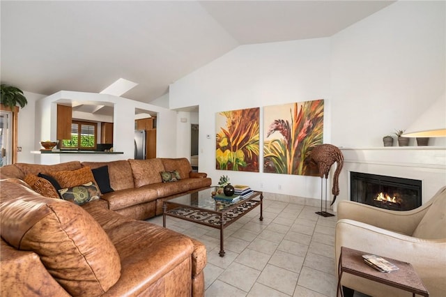 tiled living room featuring lofted ceiling