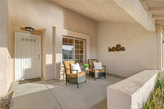 doorway to property featuring a patio