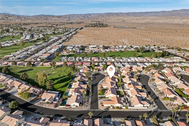 birds eye view of property featuring a mountain view