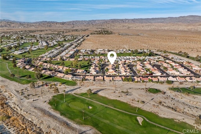 birds eye view of property featuring a mountain view