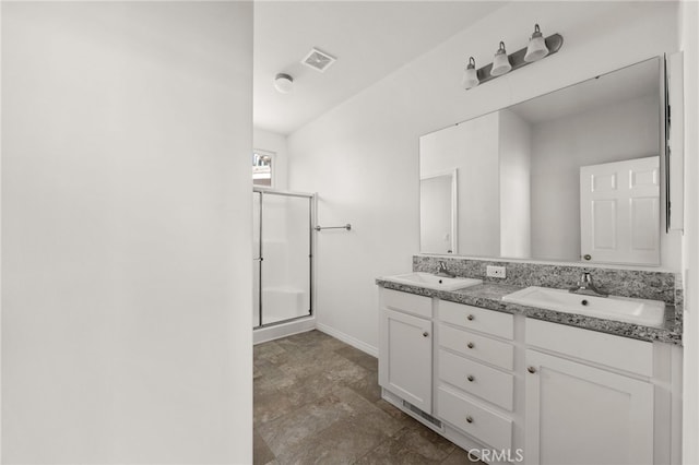 bathroom with vanity and walk in shower