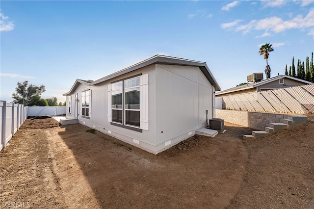 view of property exterior with central AC unit