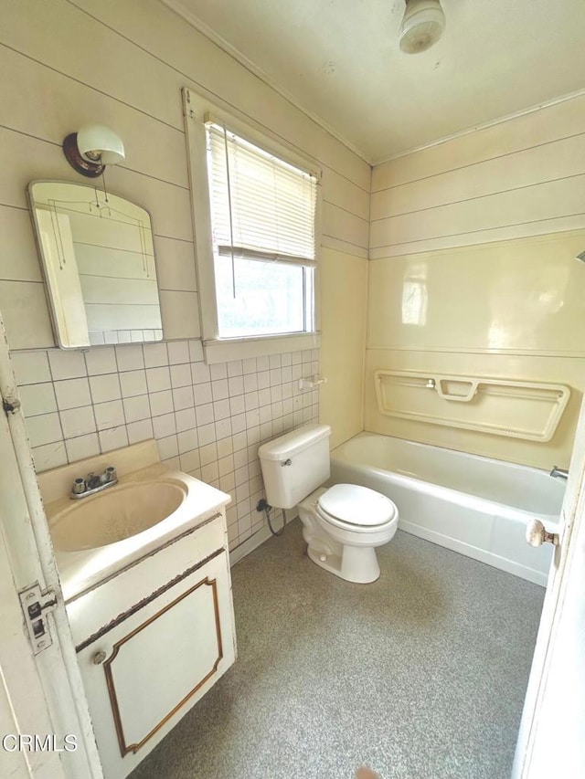 full bathroom featuring toilet, vanity, and tub / shower combination