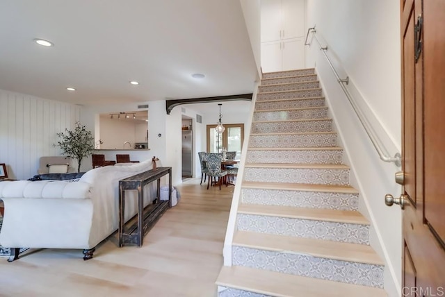 stairway featuring hardwood / wood-style flooring