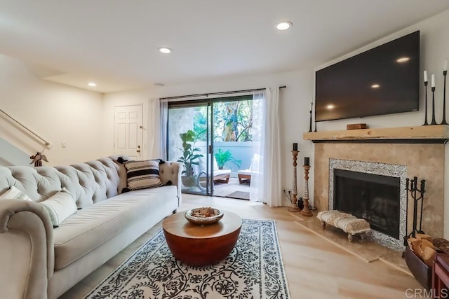 living room featuring light hardwood / wood-style floors and a fireplace