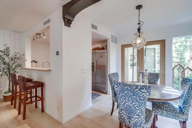 dining space with a chandelier