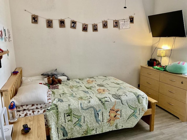 bedroom with light hardwood / wood-style floors