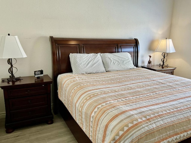 bedroom with light hardwood / wood-style flooring