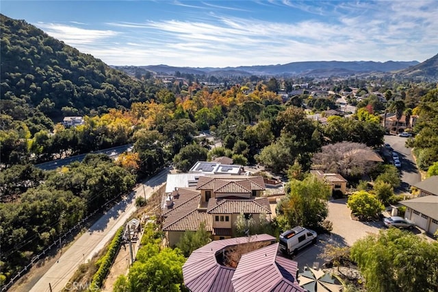 birds eye view of property featuring a mountain view