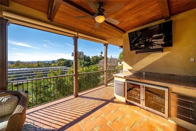 interior space with wood ceiling, ceiling fan, and beamed ceiling