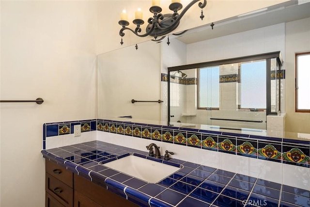 bathroom with vanity and walk in shower