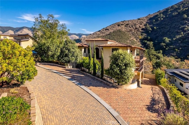 exterior space featuring a mountain view