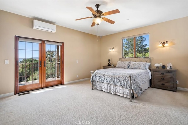 bedroom with access to exterior, carpet, french doors, a wall unit AC, and ceiling fan