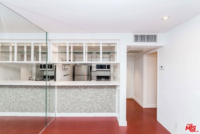 interior space featuring appliances with stainless steel finishes