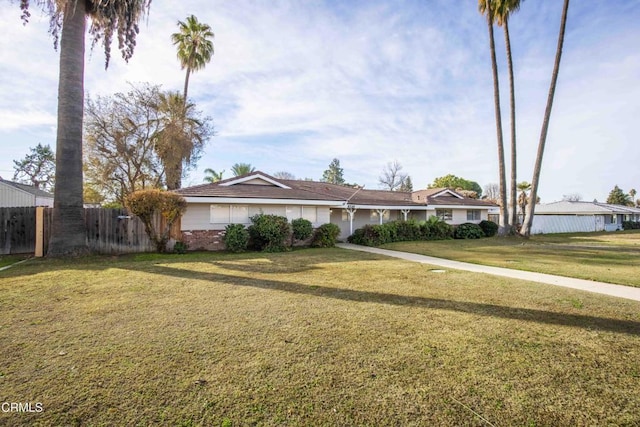 ranch-style home with a front yard