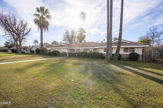 ranch-style house with a front yard