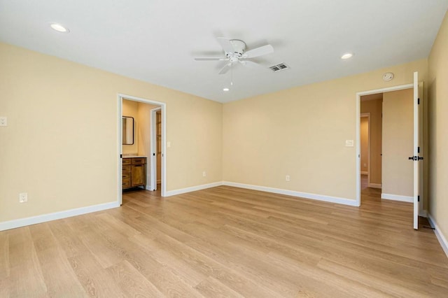 unfurnished room with ceiling fan and light hardwood / wood-style floors