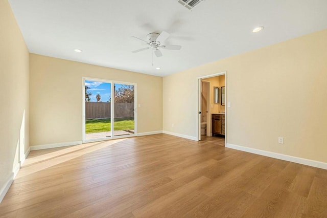 unfurnished room with ceiling fan and light hardwood / wood-style floors