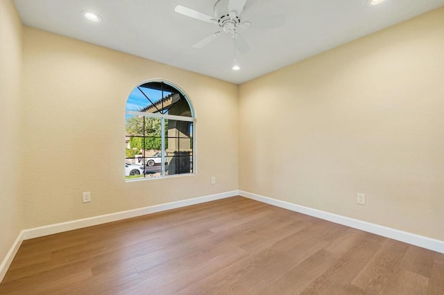 spare room featuring ceiling fan and light hardwood / wood-style floors