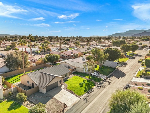 birds eye view of property with a mountain view