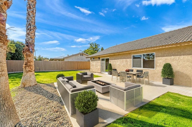 view of patio featuring an outdoor living space with a fire pit