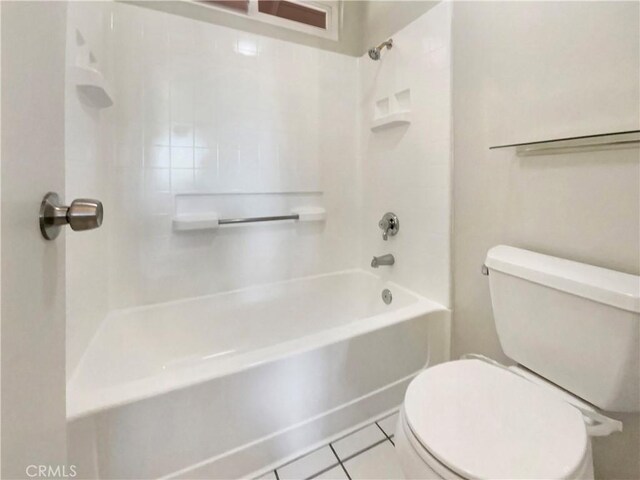 full bathroom with toilet and tile patterned flooring