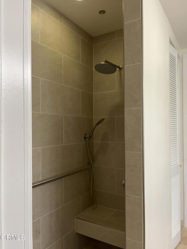 bathroom with tiled shower