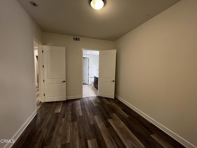 interior space with dark hardwood / wood-style flooring